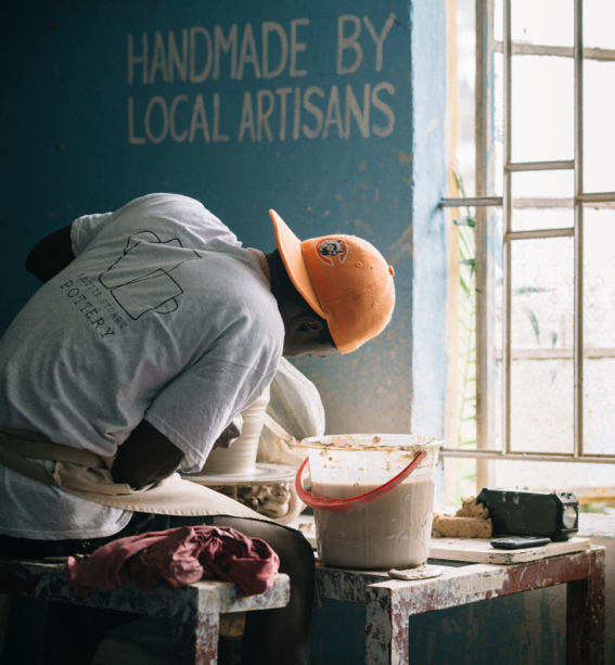 Artisan making pottery